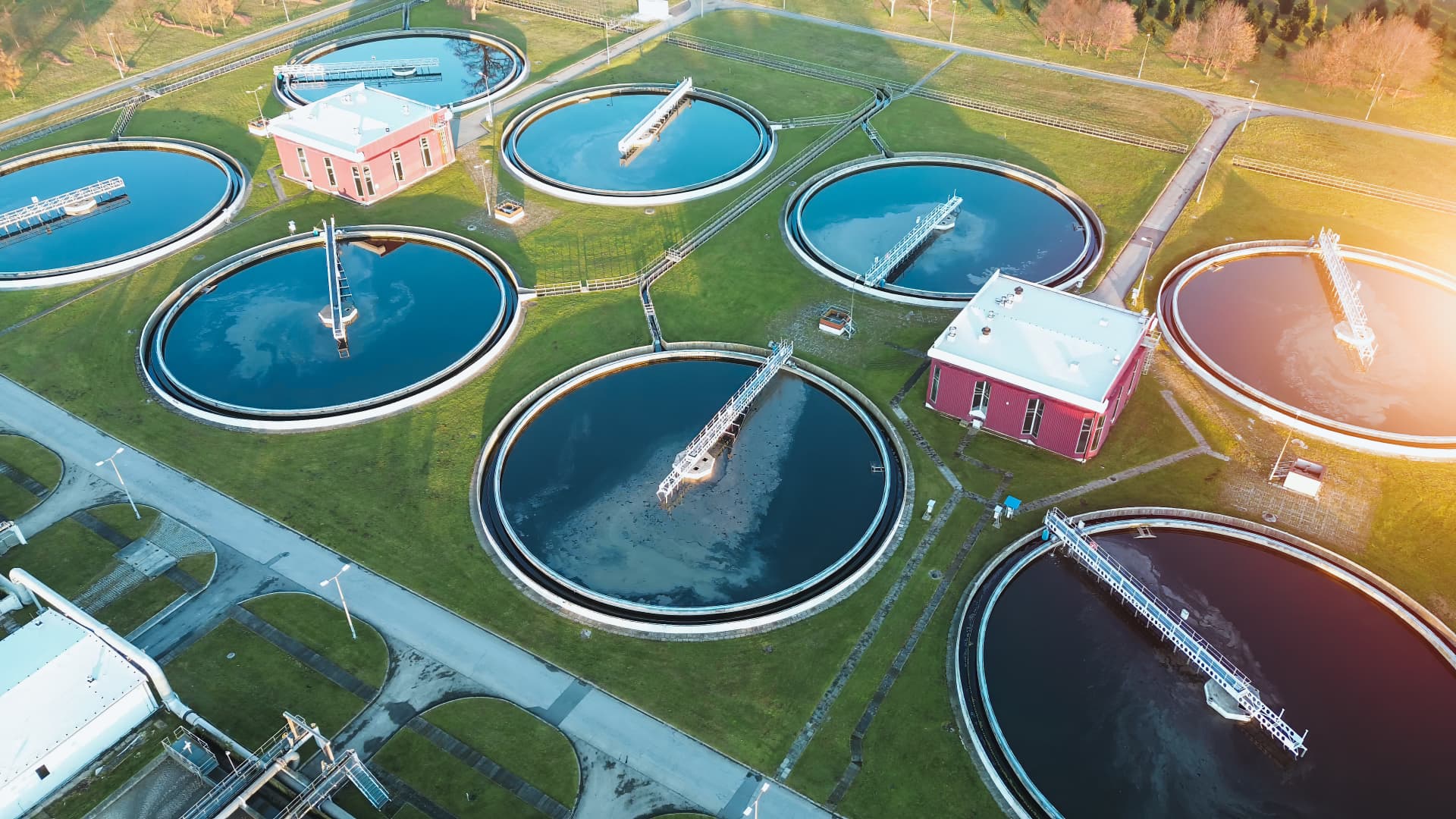 Aerial view of a water treatment facility at sunset
